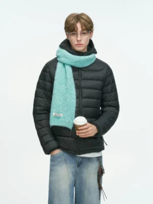 Black hooded quilted down puffer jacket shown from the front with horizontal channel quilting, zipper closure, mint green scarf, baggy jeans, and Korean streetwear styling