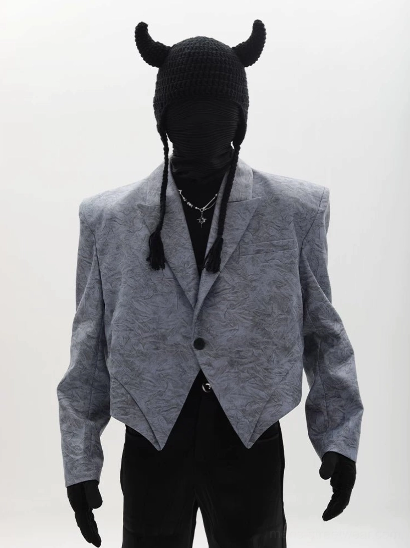 Dusty blue asymmetric cropped blazer with sharp pointed hem, padded shoulders and single button streetwear front view