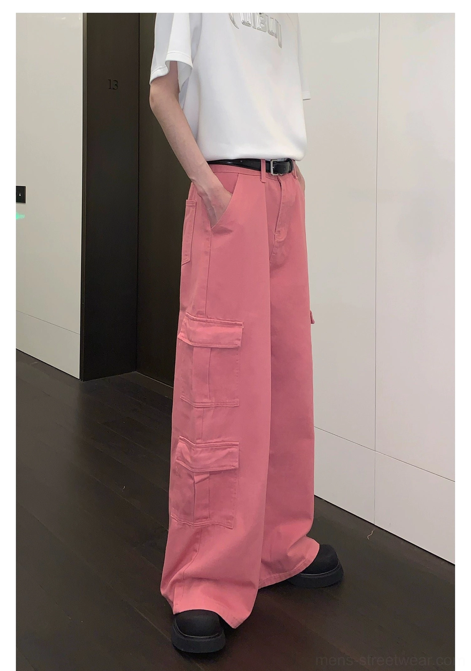 Dusty pink wide-leg cargo pants with full-length silhouette and functional pocket details for modern urban outfits