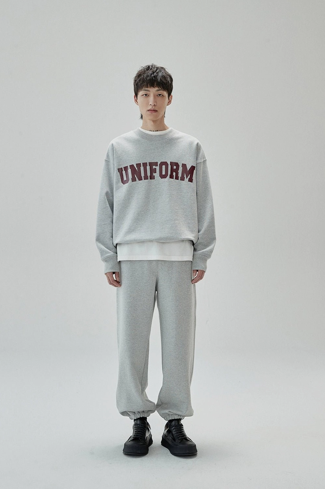 Modern East Asian fashion inspired UNIFORM crewneck sweatshirt with oversized proportions
