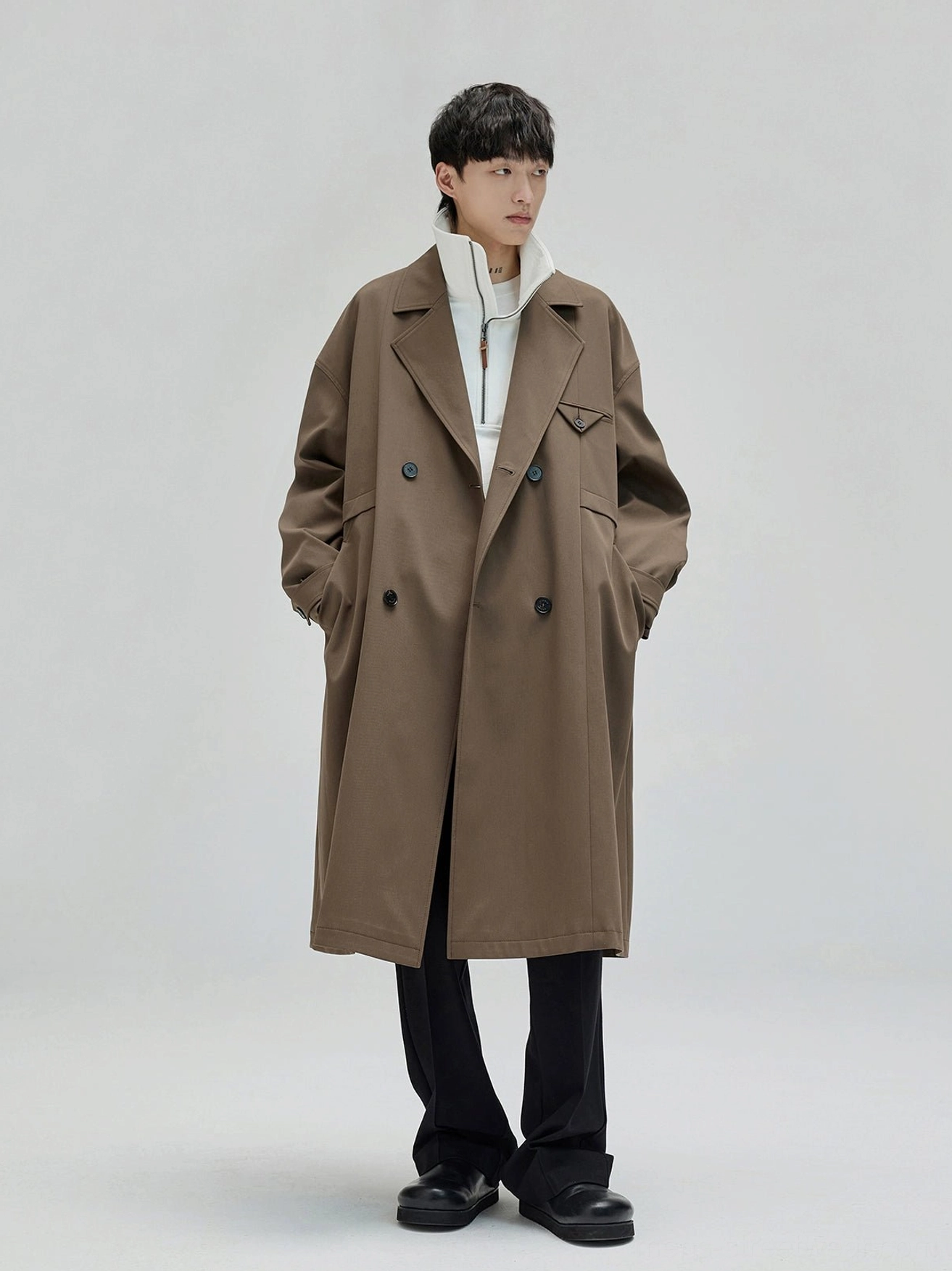Brown oversized double breasted wool coat styled with relaxed wide leg suit trousers in modern Seoul fashion