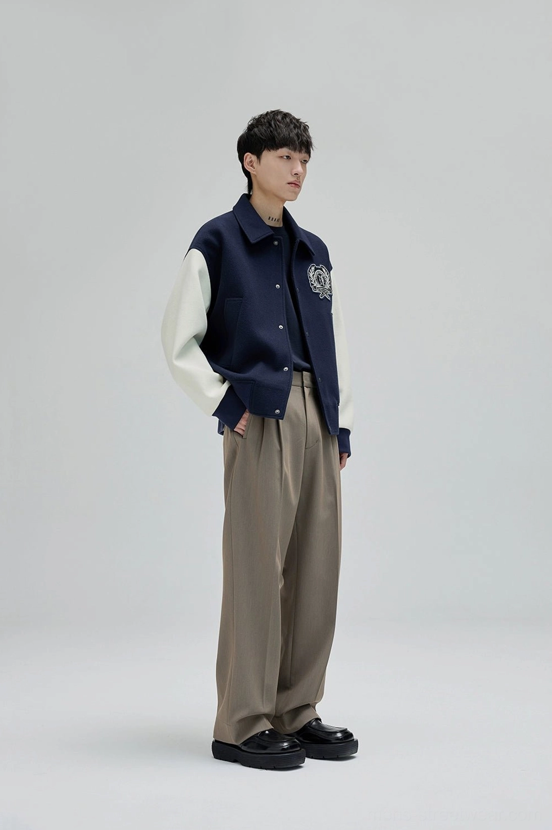 Wide leg suit trousers with flexible suiting fabric and clean pleated construction for everyday wear