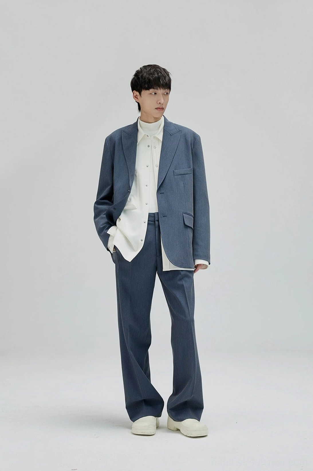 Wide leg suit pants with fluid drape and oversized proportions for modern Asian street fashion