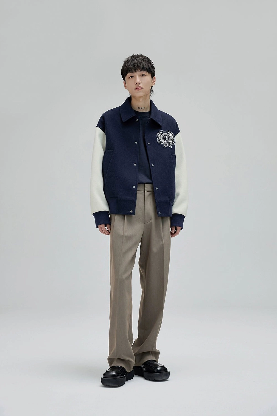 Refined mens tailored wide leg pants with smooth suiting finish and contemporary East Asian silhouette