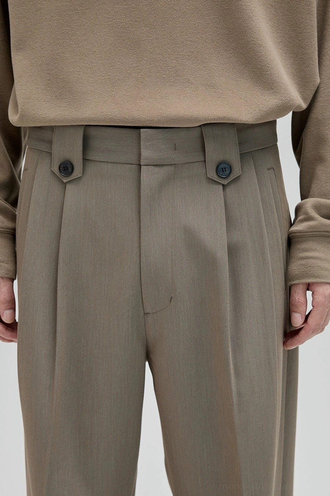 Wide leg suit pants with architectural pleats and stacked hem effect for contemporary Seoul fashion