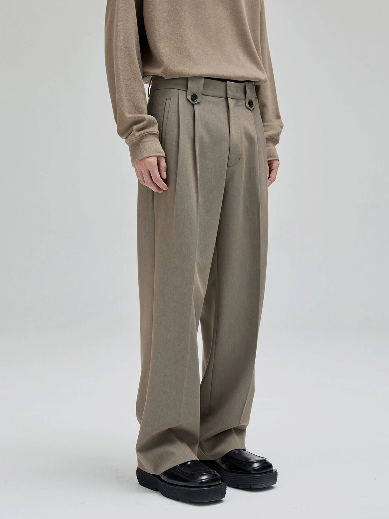 Taupe gray wide leg suit pants with front pleats adjustable waist buttons and relaxed Korean streetwear tailoring