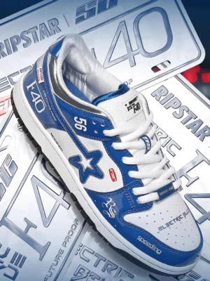 Single electric blue Y2K racing sneaker shown from a three-quarter overhead angle with glossy panels, racing graphics, and motorsport-inspired styling