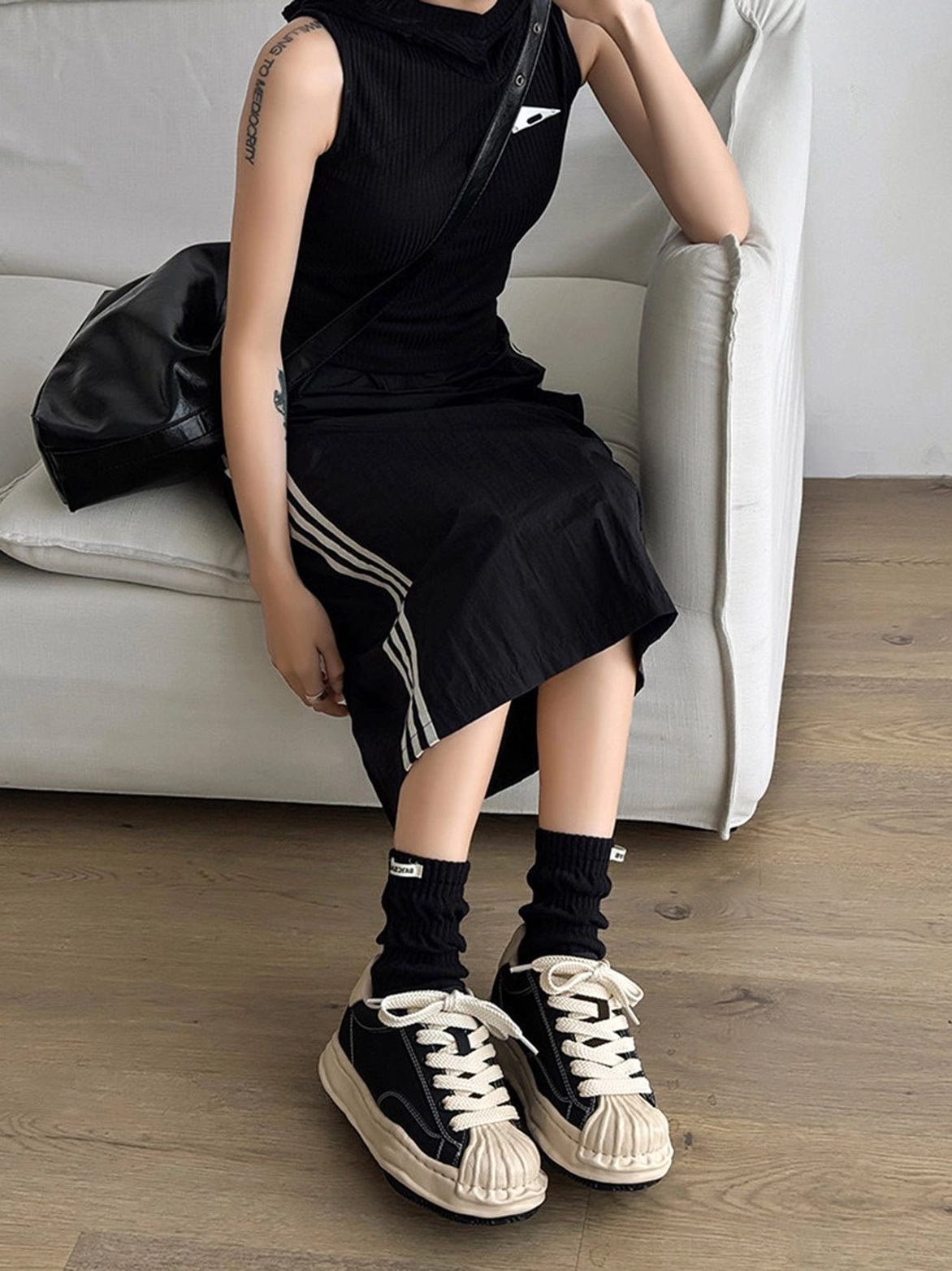 Elevated black shell-toe sneakers with cream contrast panels and 7 cm platform streetwear outsole