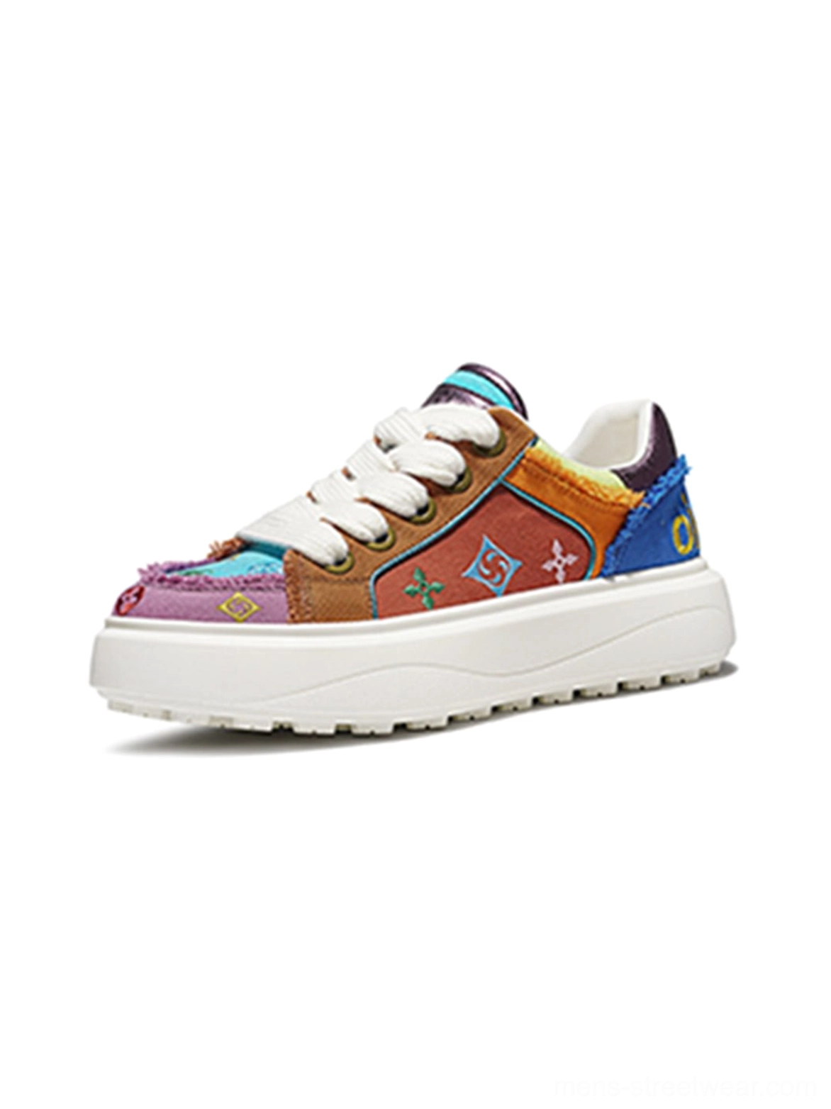 Multicolor patchwork platform skate sneaker with embossed motifs embroidered panels frayed fabric details and thick white outsole shown from the right side