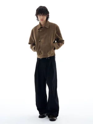 Dark brown espresso faux suede cropped toggle work jacket front full body view styled with black wide leg trousers