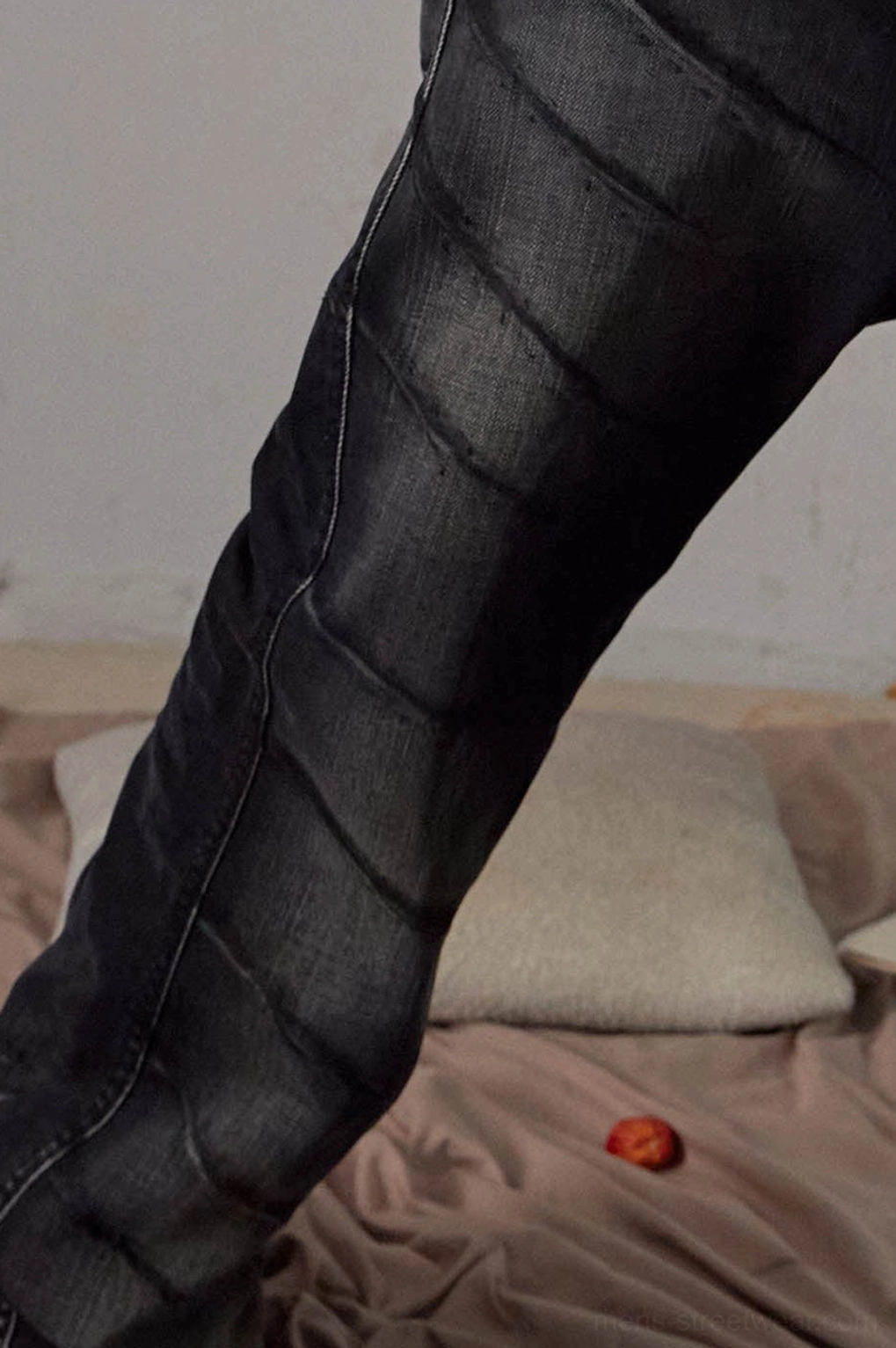Faded black chain detail flared jeans showcasing Seoul streetwear denim construction and wide-leg silhouette