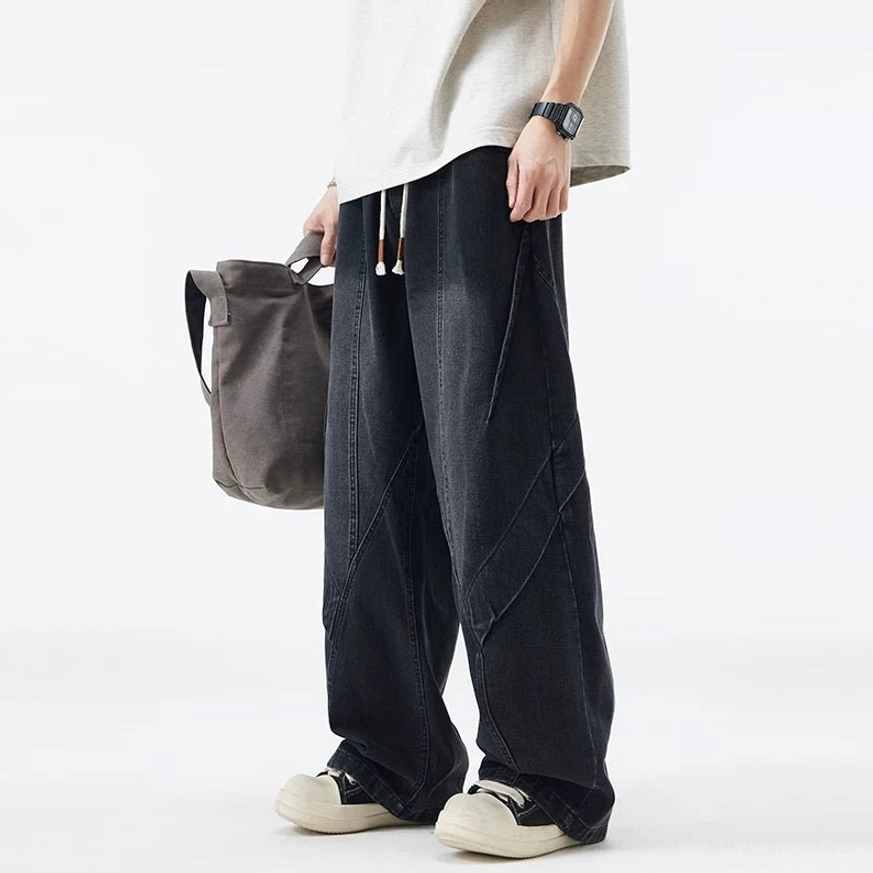Faded black paneled drawstring wide-leg jeans product color option with oversized streetwear silhouette