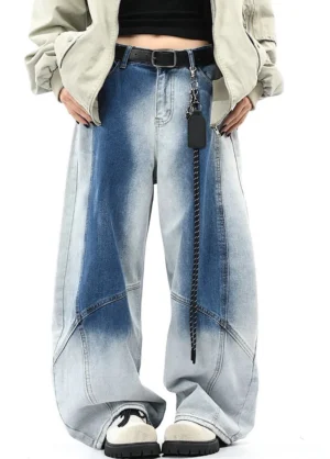 Front full-body view of blue faded gradient wide-leg denim pants with curved panel seams styled in Seoul streetwear