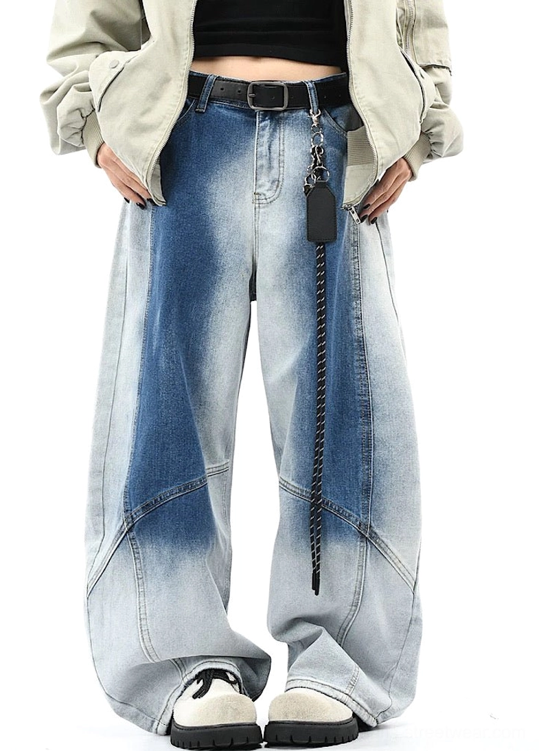 Front full-body view of blue faded gradient wide-leg denim pants with curved panel seams styled in Seoul streetwear