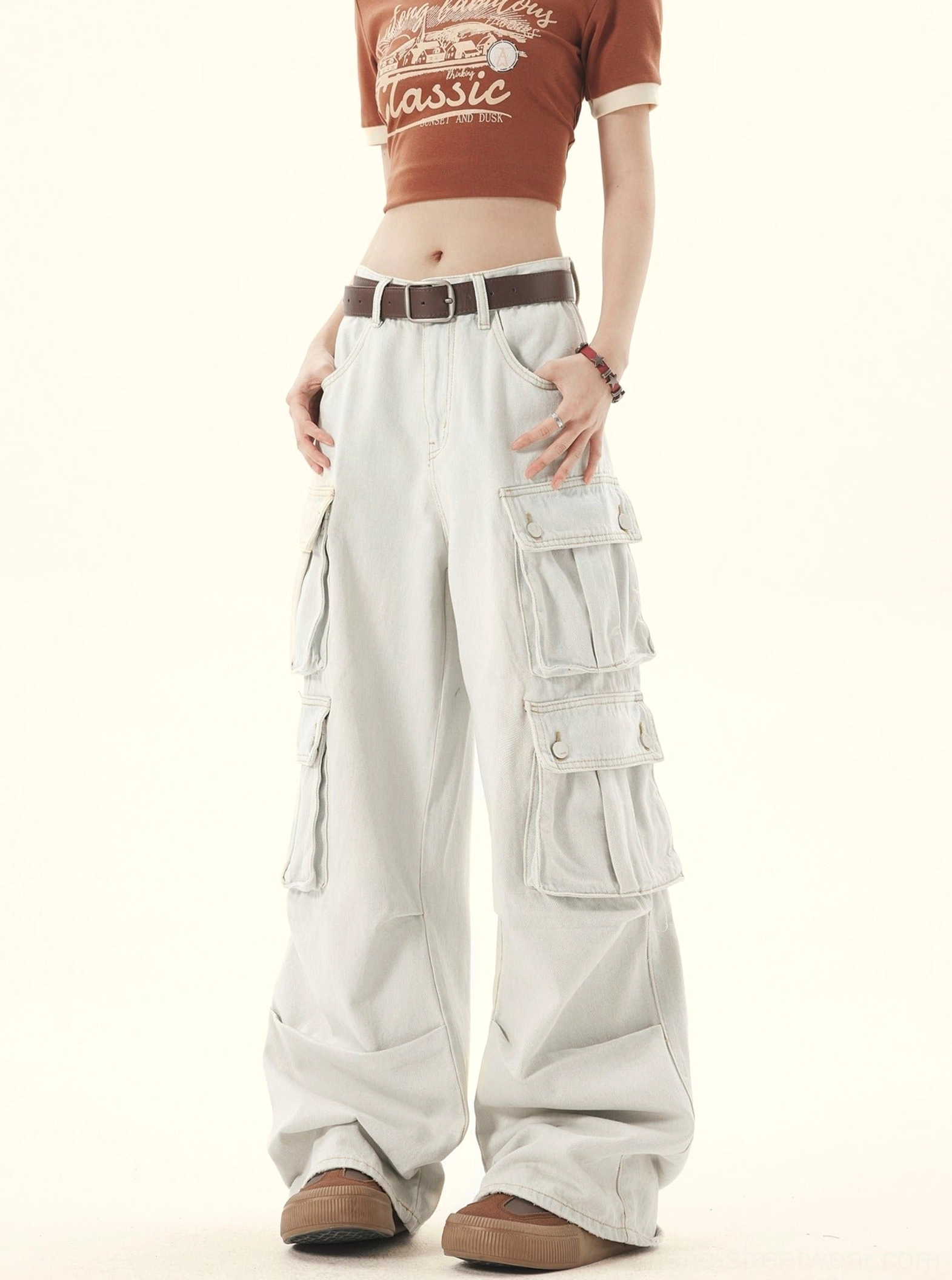 Front angled view of faded light denim wide-leg cargo pants with relaxed Korean fashion styling
