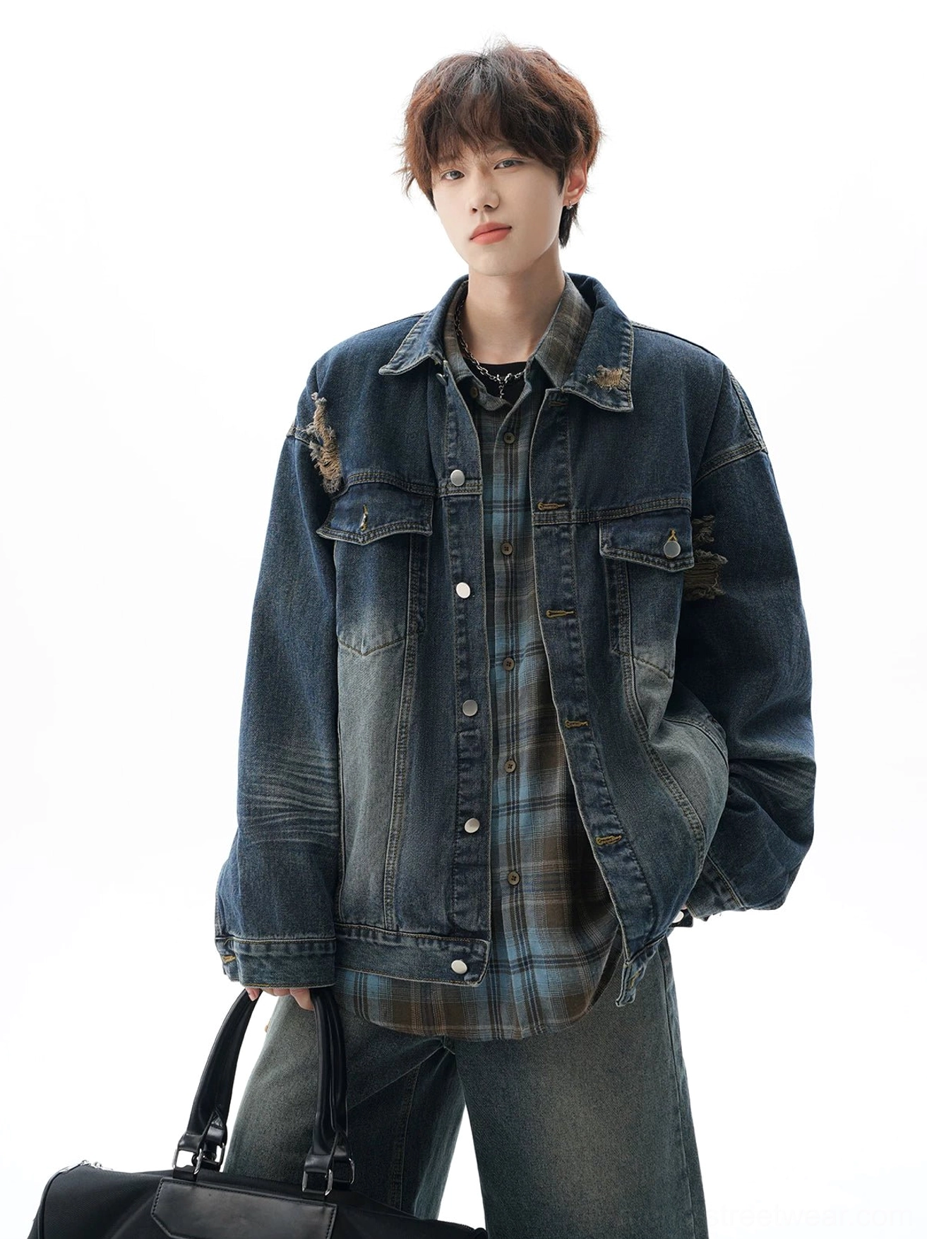 Faded oversized denim jacket with distressed vintage finish, relaxed dropped shoulders, panel details, and Korean-style streetwear versatility