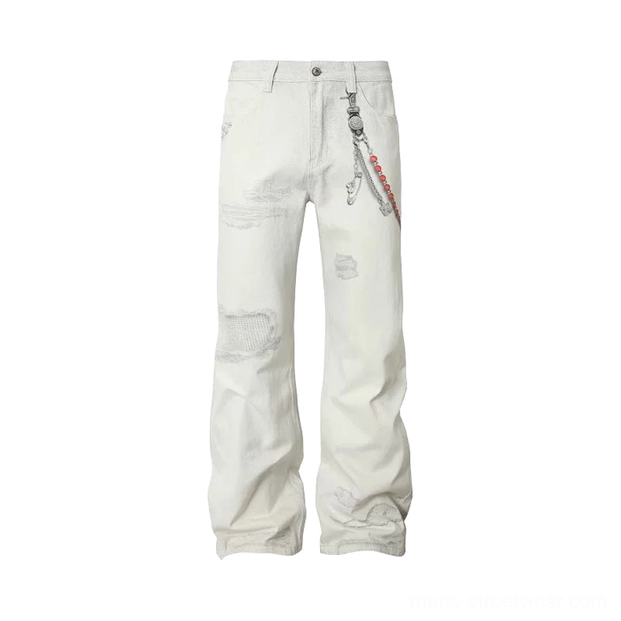 Faded white distressed chain-detail wide-leg jeans with oversized streetwear proportions and bold monochrome styling potential