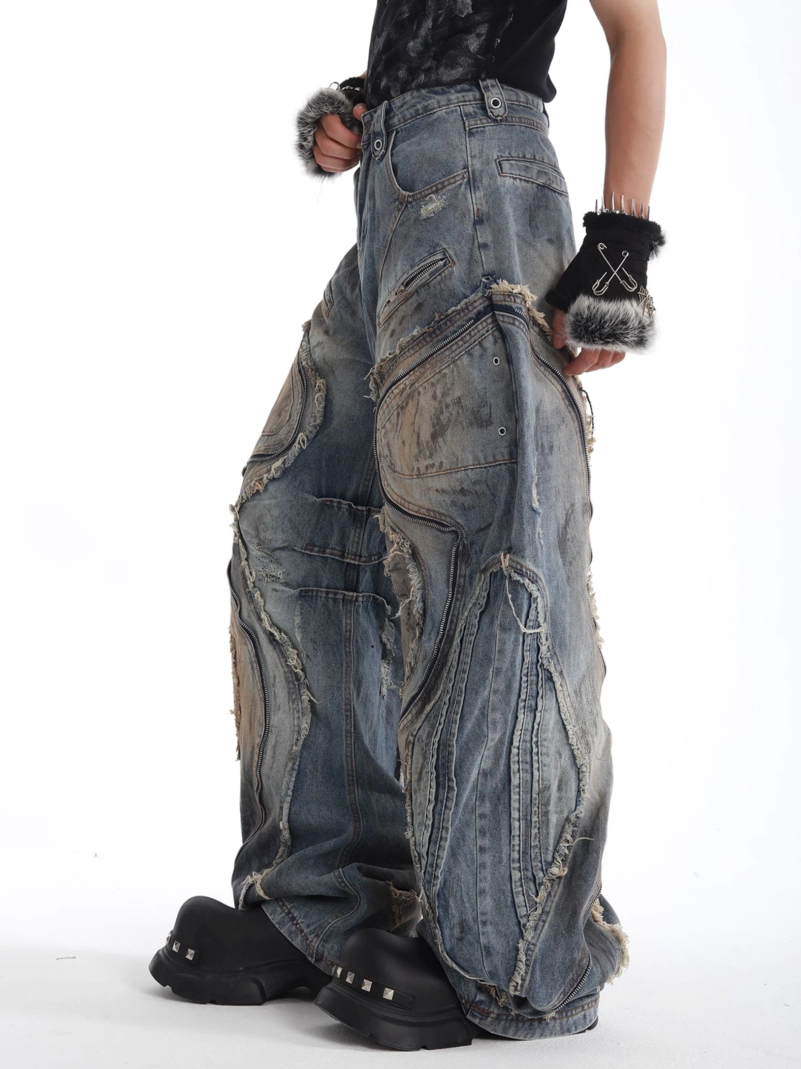 Right three-quarter view of sculptural curved-panel wide-leg jeans with asymmetrical distressed seams and a faded blue Korean streetwear aesthetic