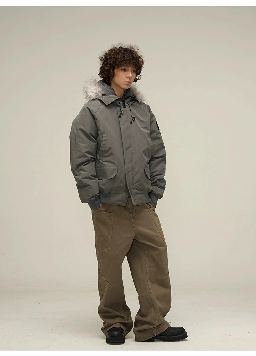 Dark grey fur hood puffer bomber jacket angled front view with front flap pockets