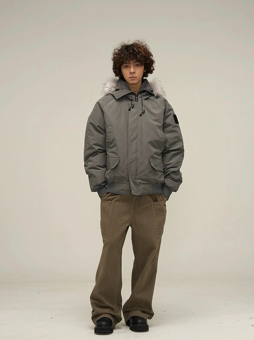 Dark grey faux fur hooded puffer bomber jacket front view styled with brown cargo pants