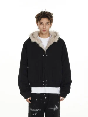 Black faux fur lined hooded cropped bomber jacket shown from the front with snap button closure, elasticated hem, and white tee styling