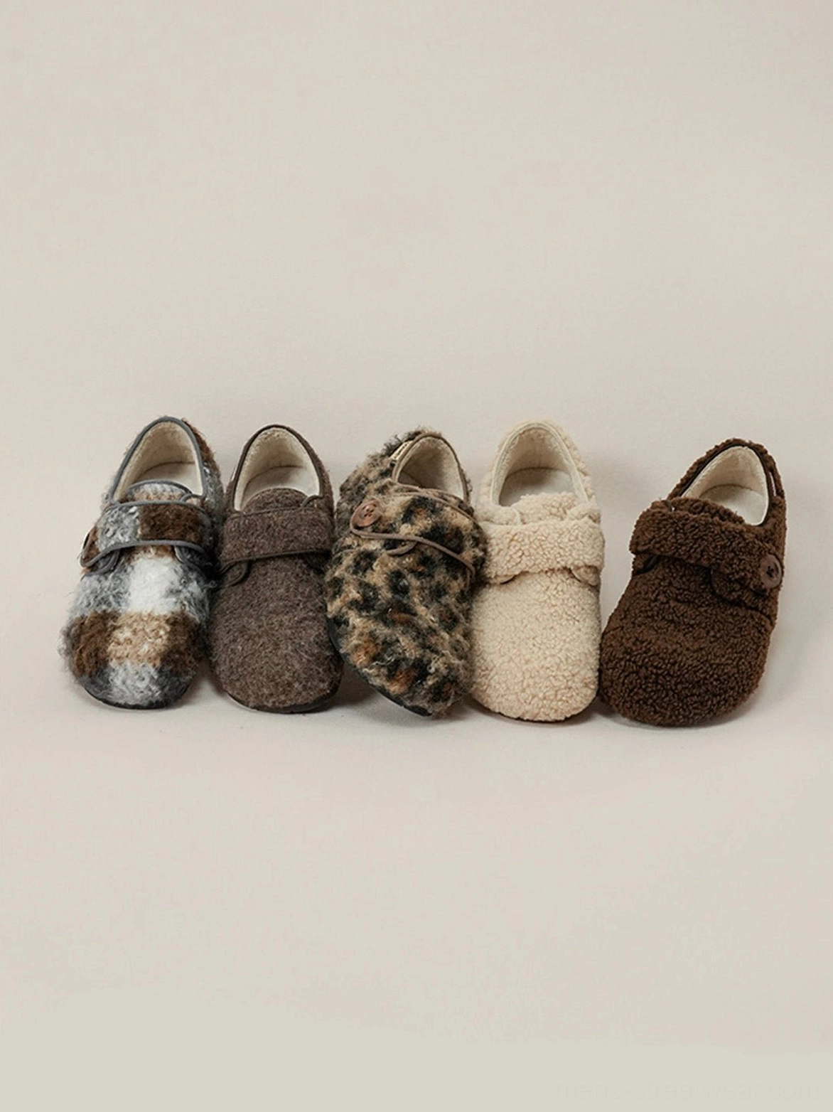 Full collection of fuzzy Velcro slip-on shoes showing leopard plaid coffee and gray coffee options