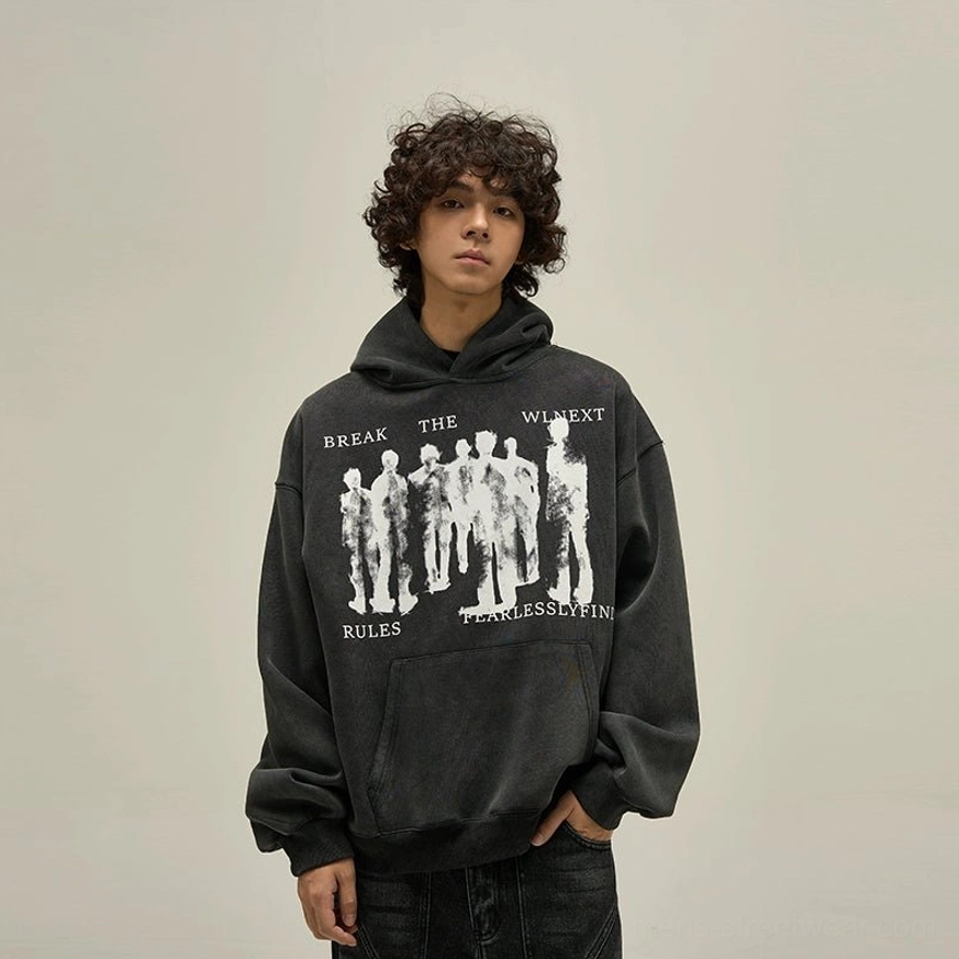 Washed black fearless oversized graphic hoodie close front view with abstract white figure print and kangaroo pocket