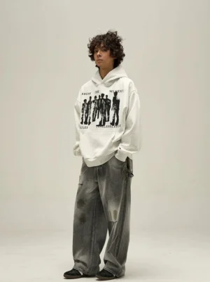 Heather gray fearless abstract figure oversized graphic hoodie front view styled with faded wide-leg jeans