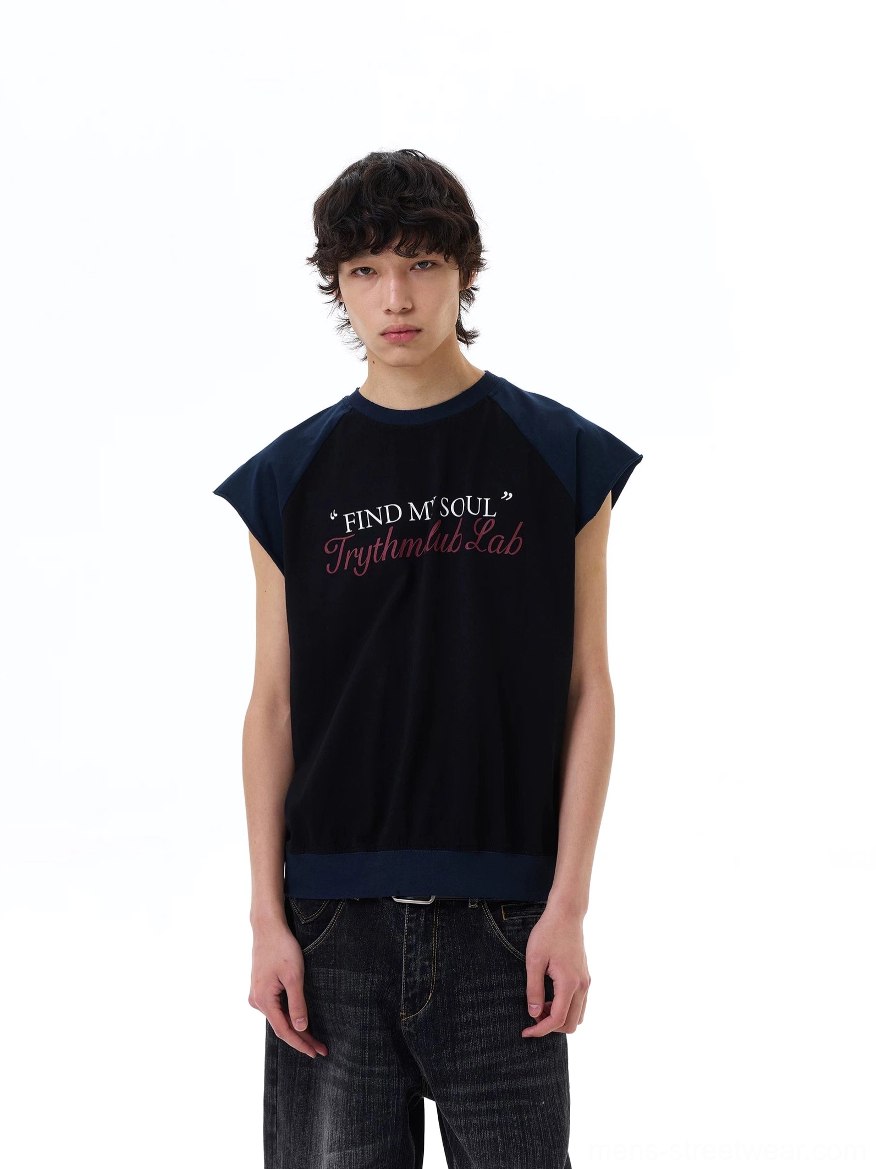 Male model wearing black Find My Soul raglan cap-sleeve Korean streetwear tee with baggy dark wash jeans, front full-body view