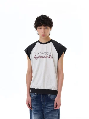 Male model wearing light gray Find My Soul raglan cap-sleeve streetwear tee with medium wash baggy jeans, front view
