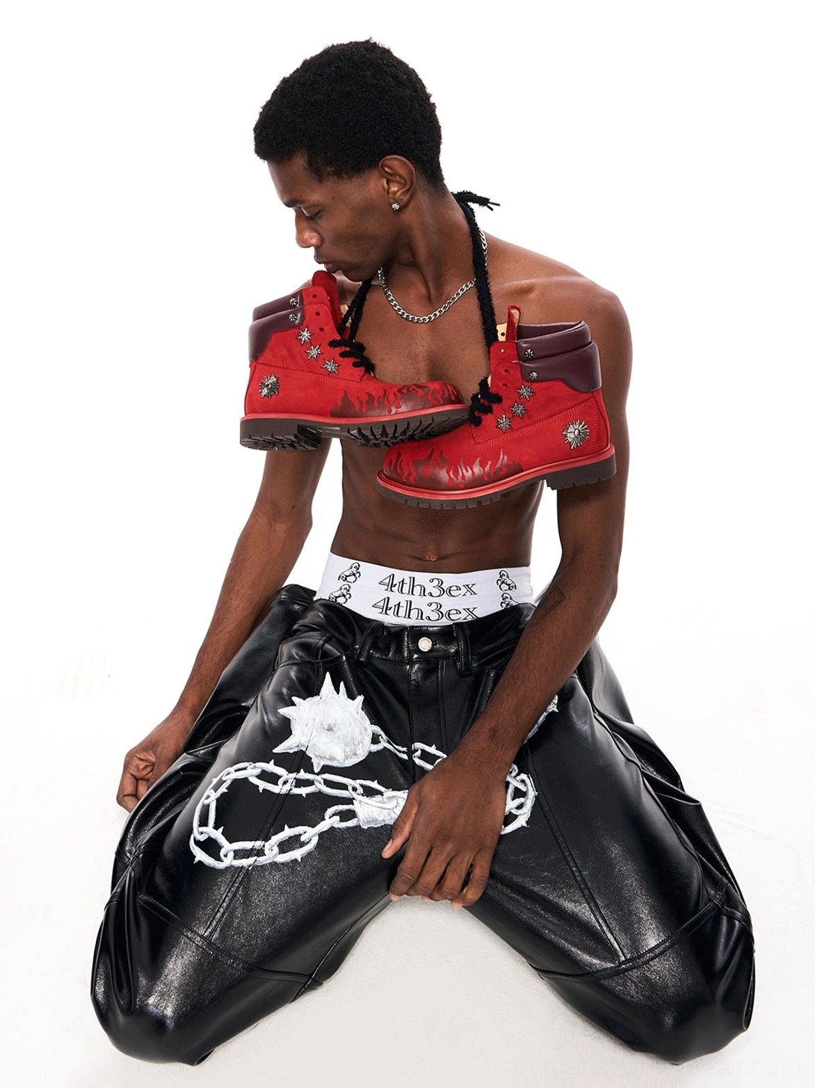 Flame appliqué genuine leather combat boots in black and red with padded collars and lace-up fronts