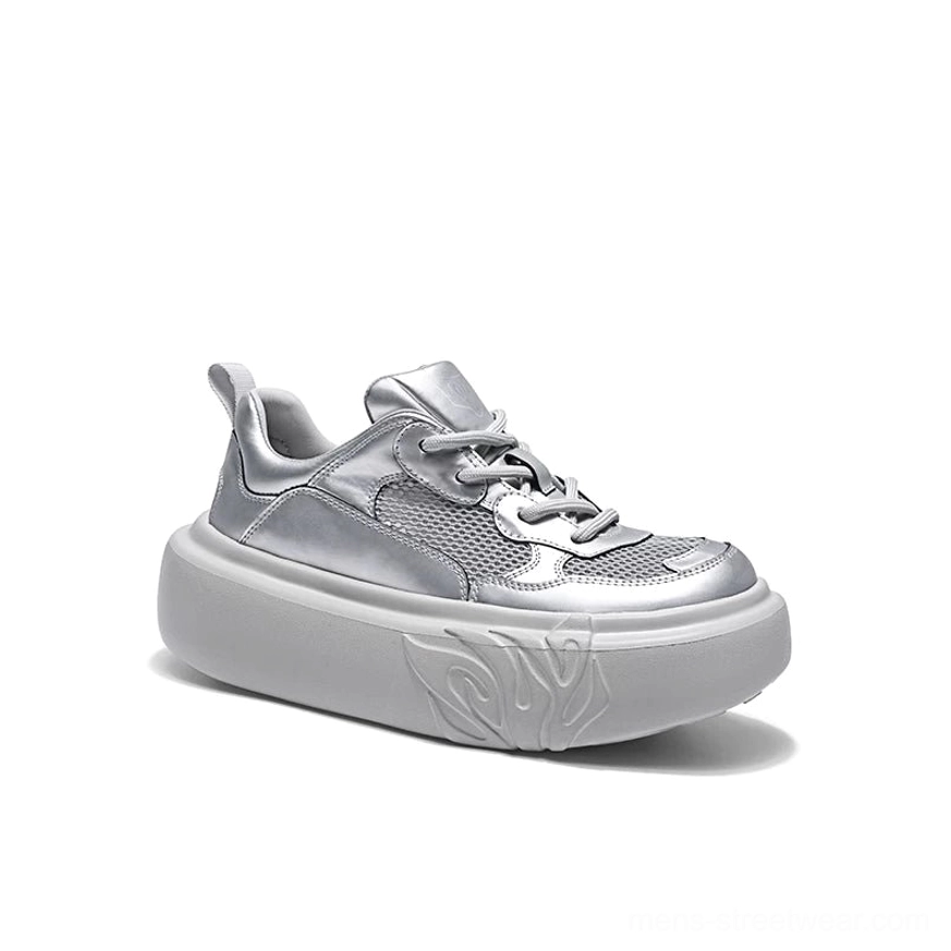 Close front three-quarter view of metallic silver flame sole mesh platform sneaker