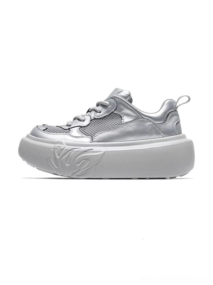 Metallic silver flame sole mesh platform sneakers in left side profile on a white studio background