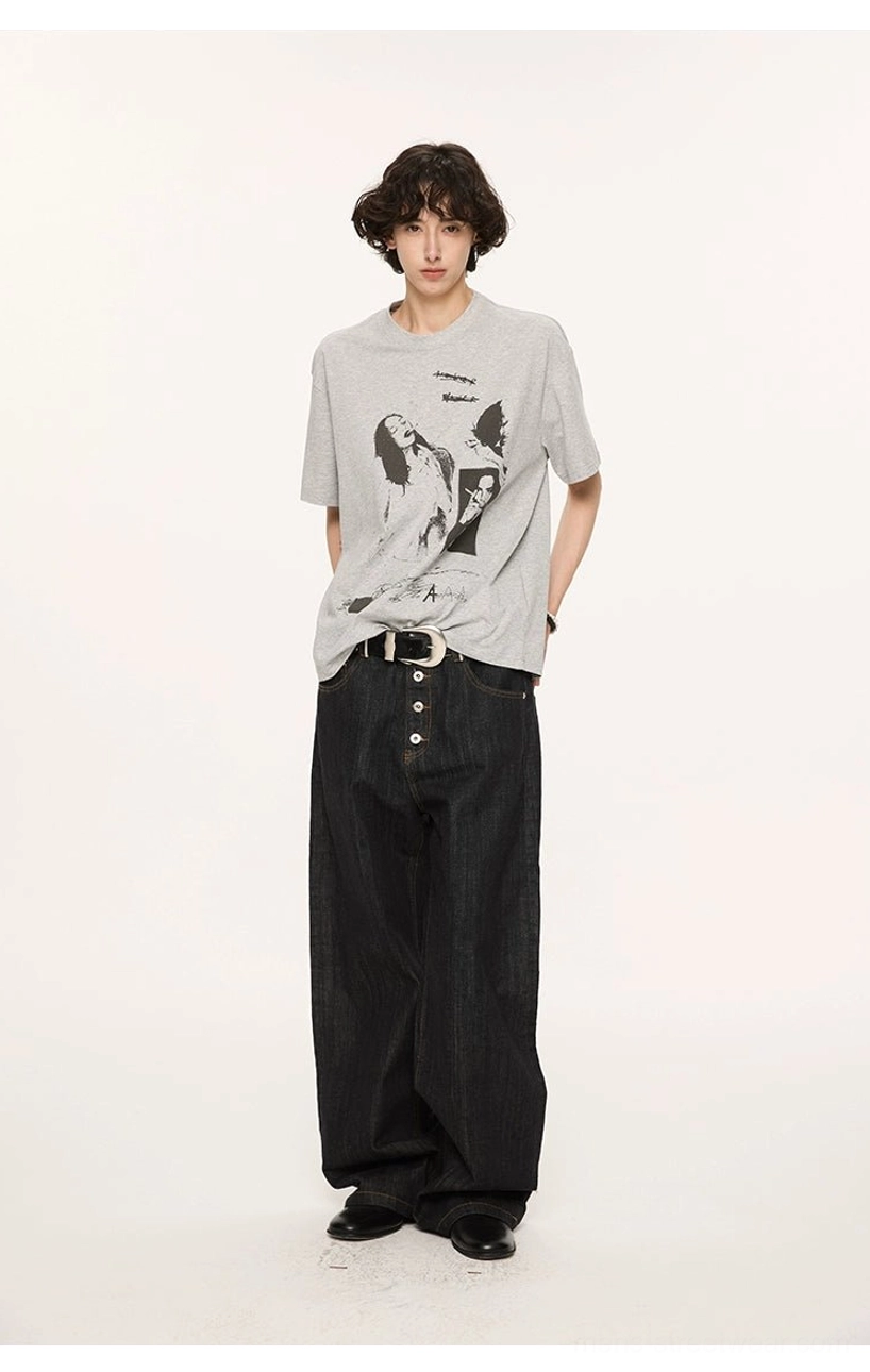 Side-front view of a floral gray relaxed graphic print T-shirt styled with high-waisted wide-leg black jeans