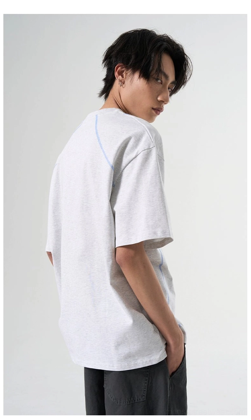 Rear three-quarter view of Flower Gray relaxed T-shirt showing structured contrast seam lines and loose fit