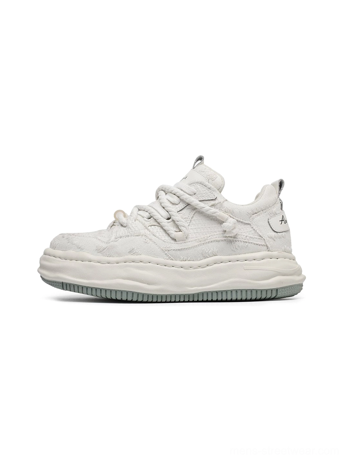 Side profile of light off-white frayed canvas platform sneakers with twisted laces, thick sculpted midsoles, and distressed Korean streetwear styling