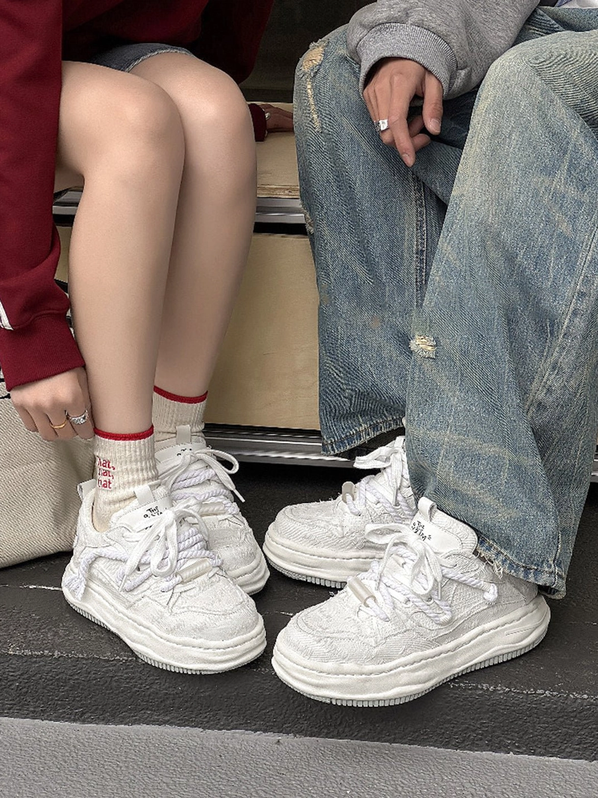 Frayed canvas platform sneakers featuring raw-edge fabric texture, raised platform soles, and contemporary Seoul fashion styling