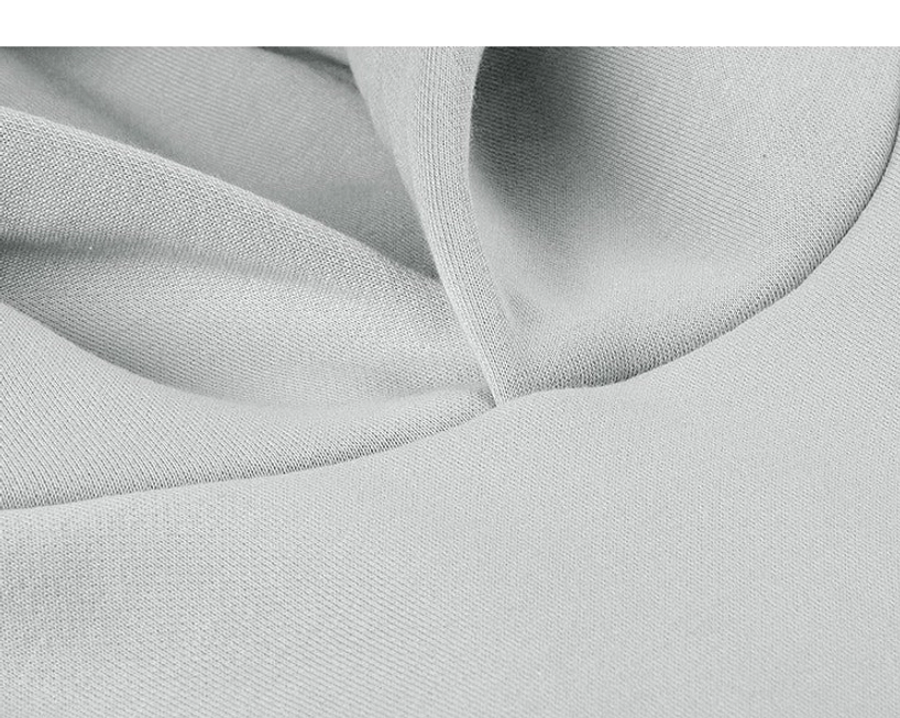 Macro detail of dense French terry cotton fabric used in the oversized streetwear hoodie