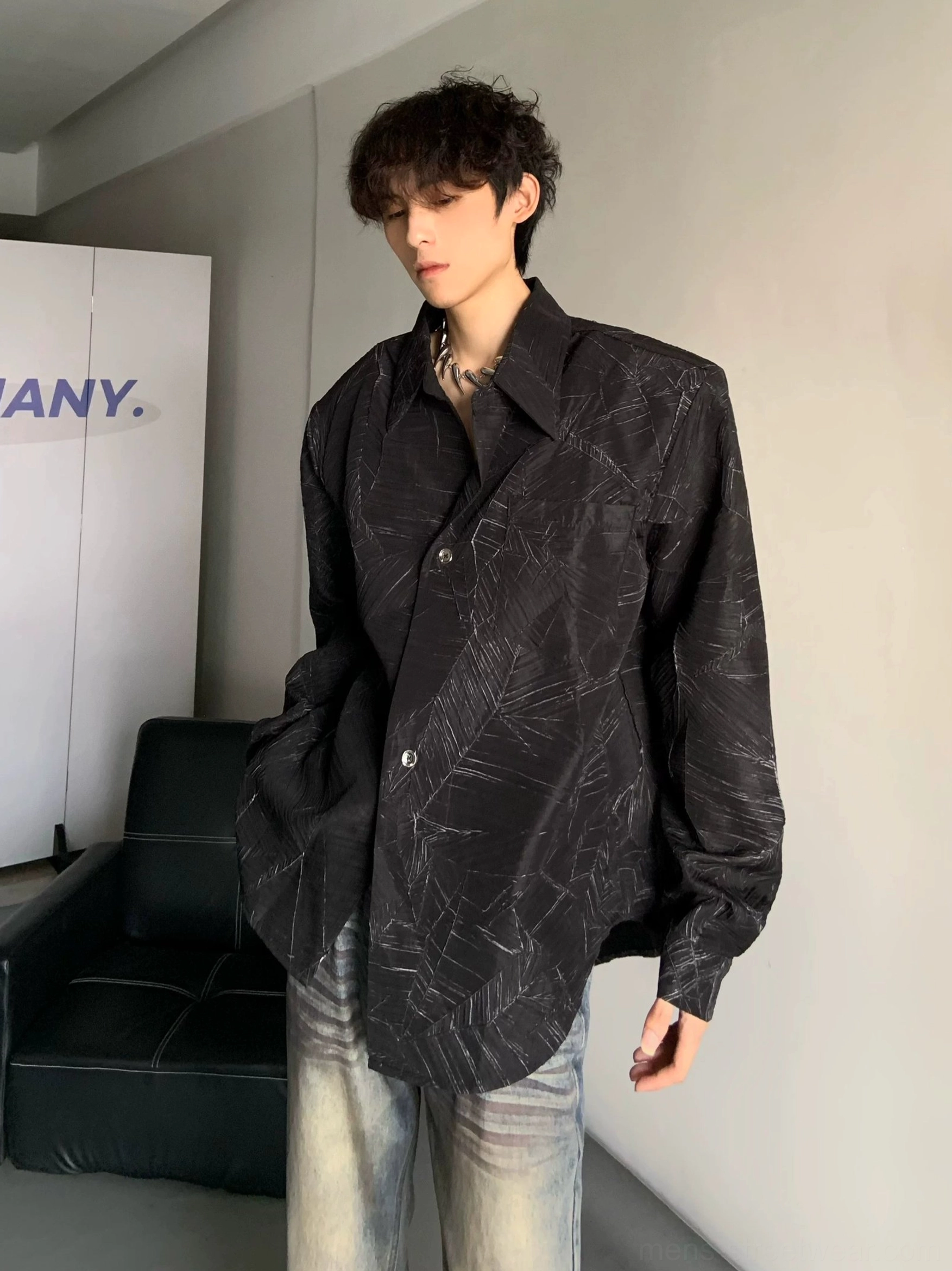 Black oversized long sleeve leaf print shirt with dropped shoulders and curved hem