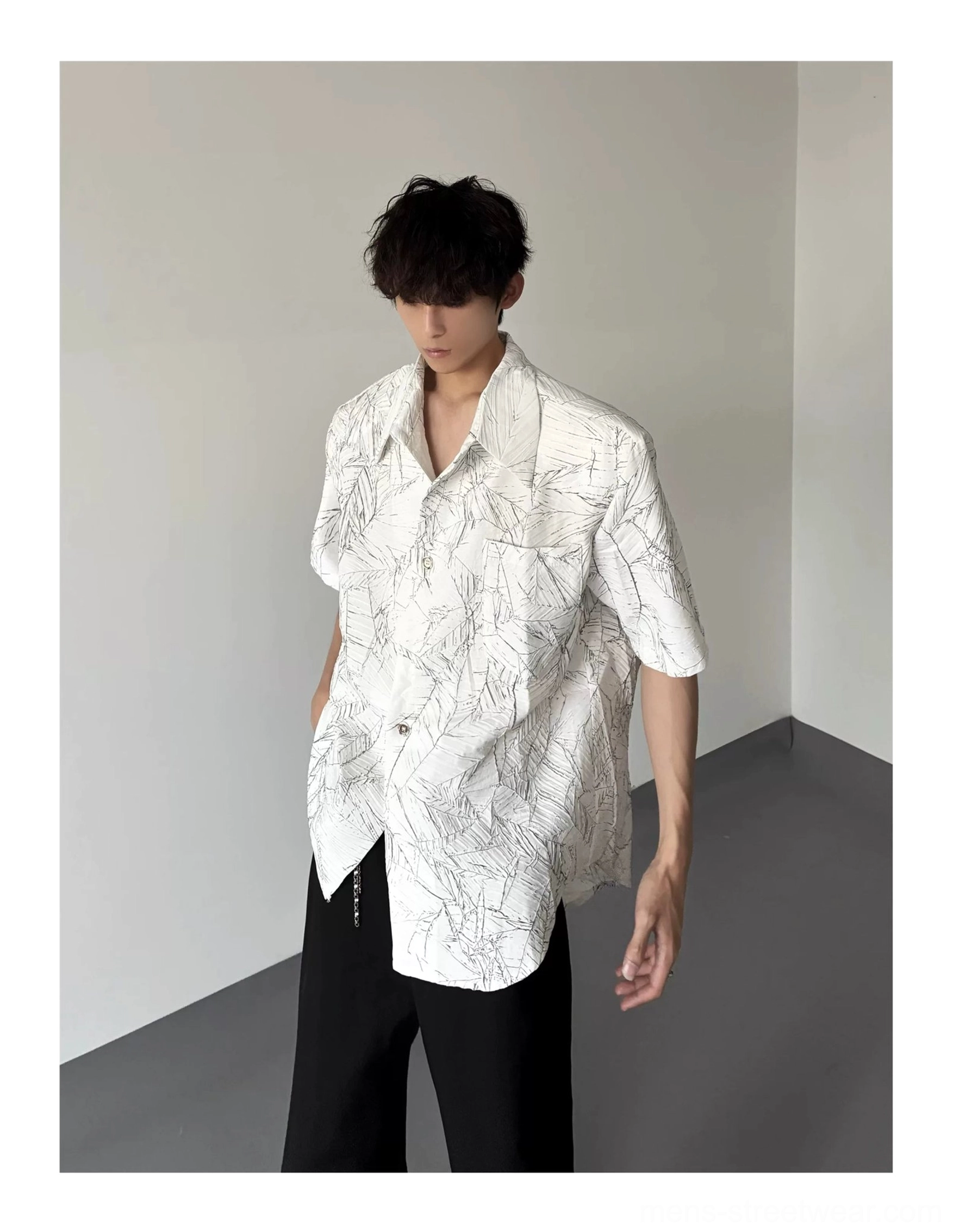 Oversized short sleeve leaf print shirt with curved hem and relaxed Korean streetwear silhouette