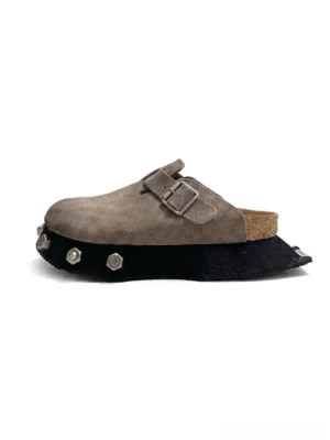 Taupe frosted suede buckle clog shown from the side with cork-look footbed and chunky black studded platform outsole