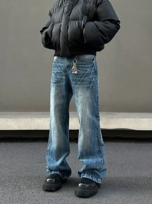 Front view of Frostline Vein distressed wide-leg blue jeans with vintage wash, stacked fit, and frayed flared hems