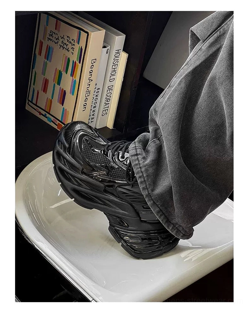 Futuristic metallic platform runner sneakers in a layered silver and black Y2K streetwear design