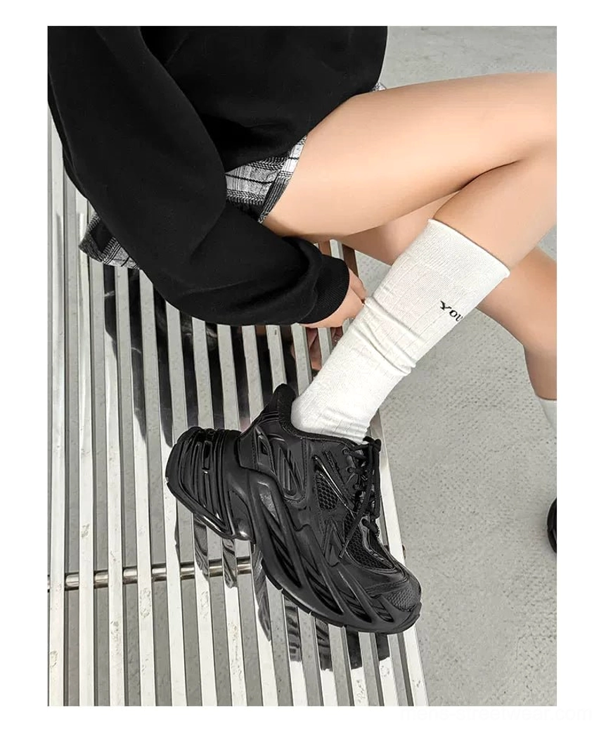 Futuristic silver chunky sneakers featuring reflective-inspired panels black accents and thick traction outsole