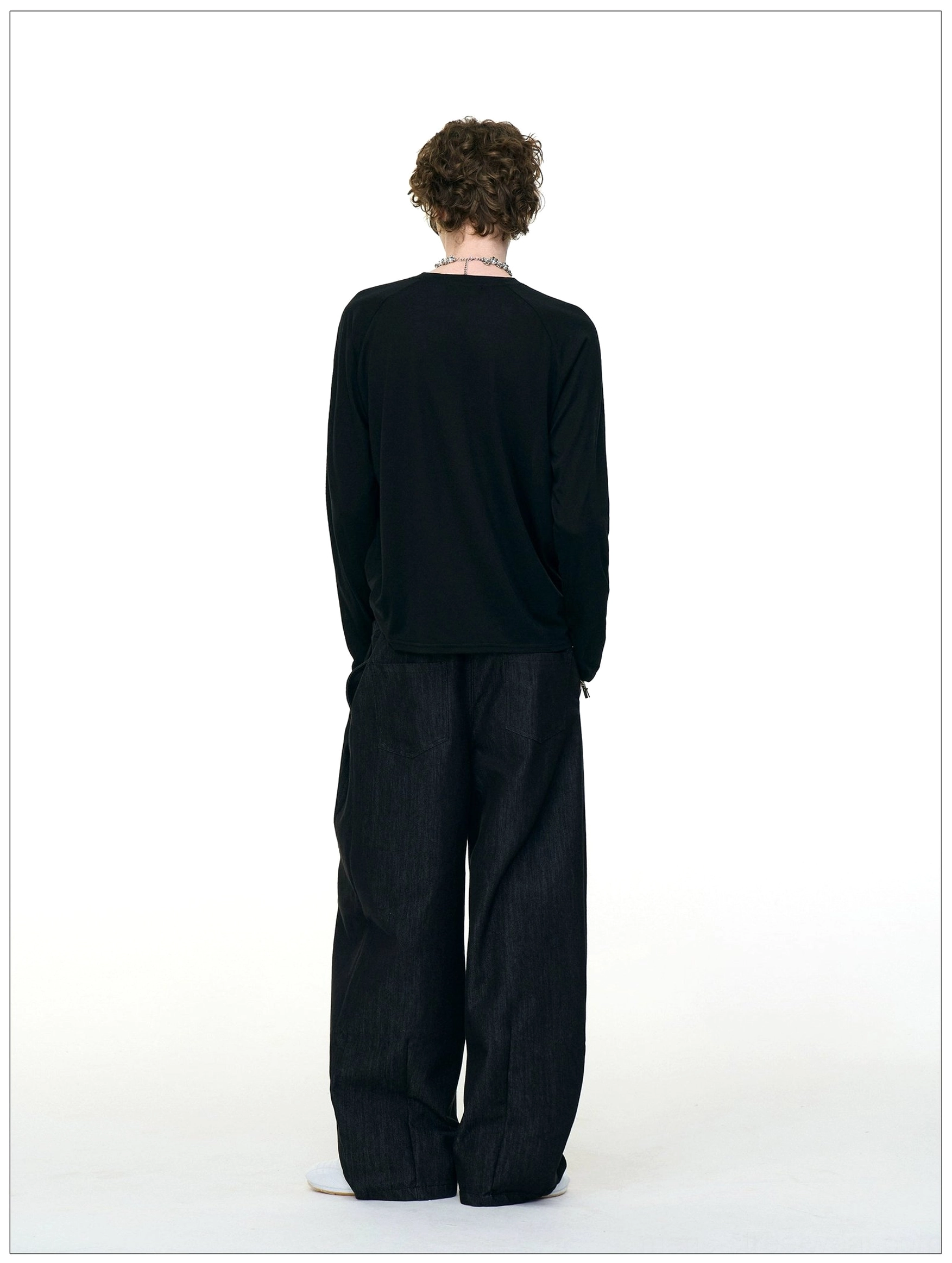 Rear view of black Ghost Walkers graphic long sleeve tee showing the clean solid back, crew neck, and raglan sleeve construction