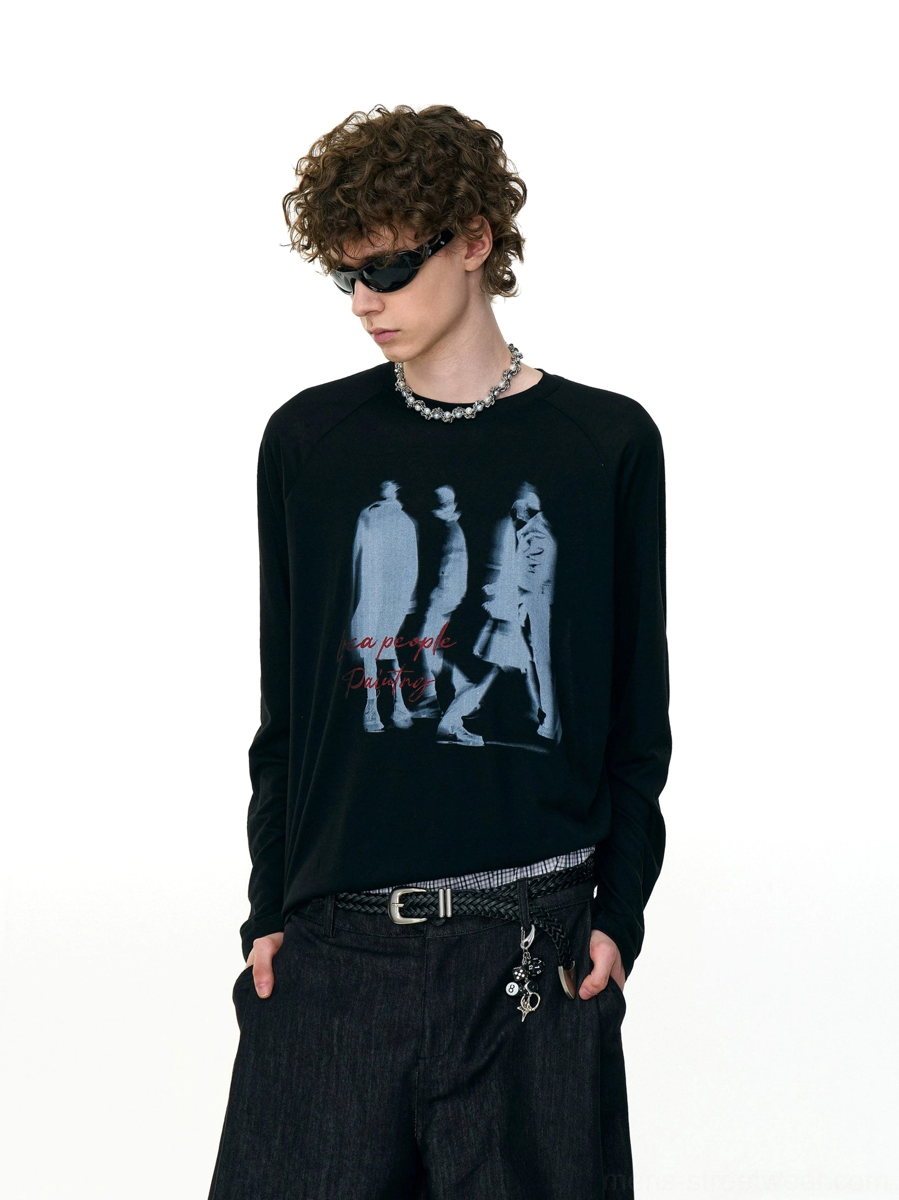 Black Ghost Walkers shadow graphic long sleeve tee with hazy walking silhouettes and red handwritten lettering on a relaxed raglan streetwear shirt
