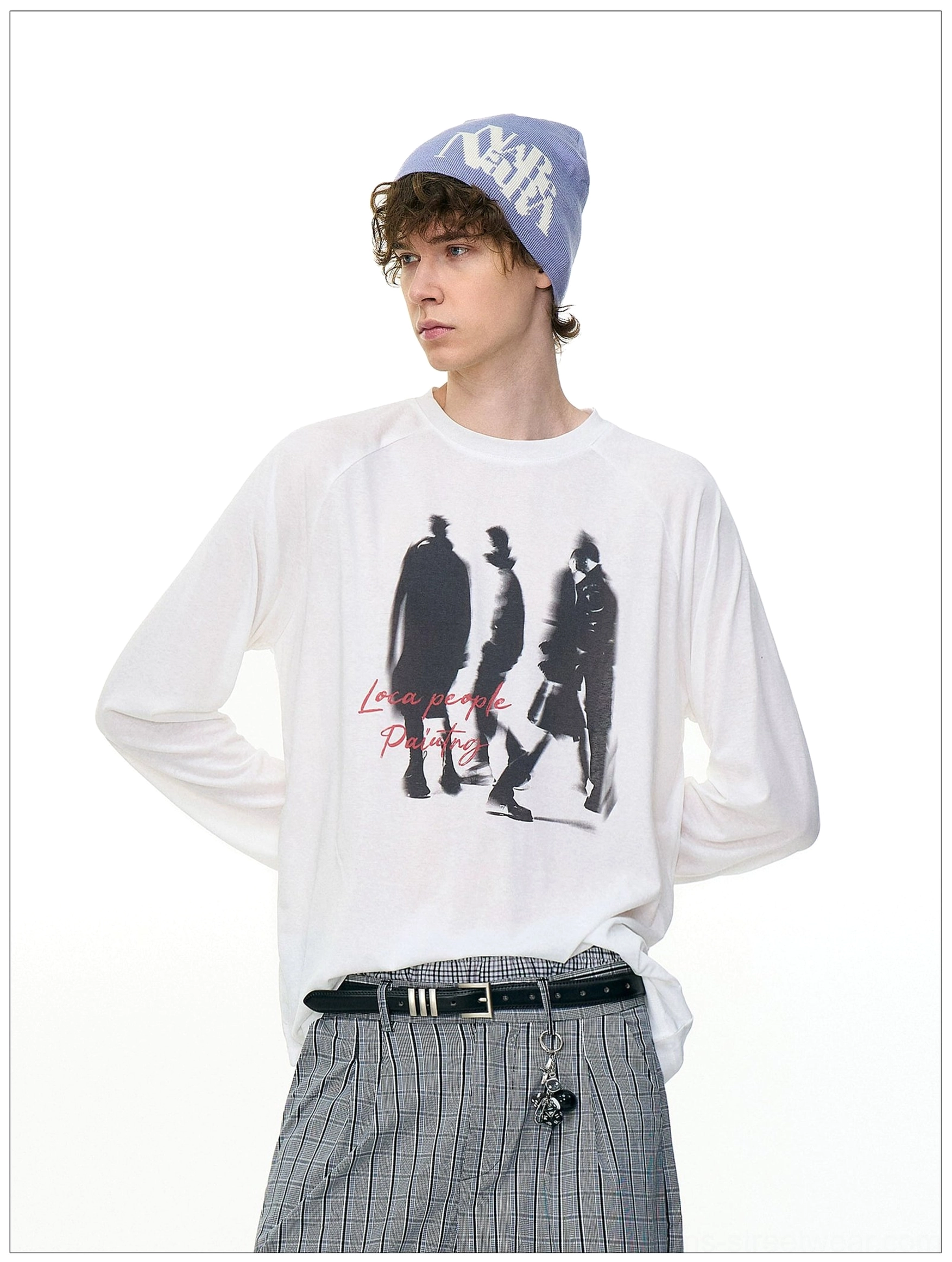 Front view of white Ghost Walkers graphic long sleeve tee with black walking silhouettes, red handwritten lettering, and raglan sleeves