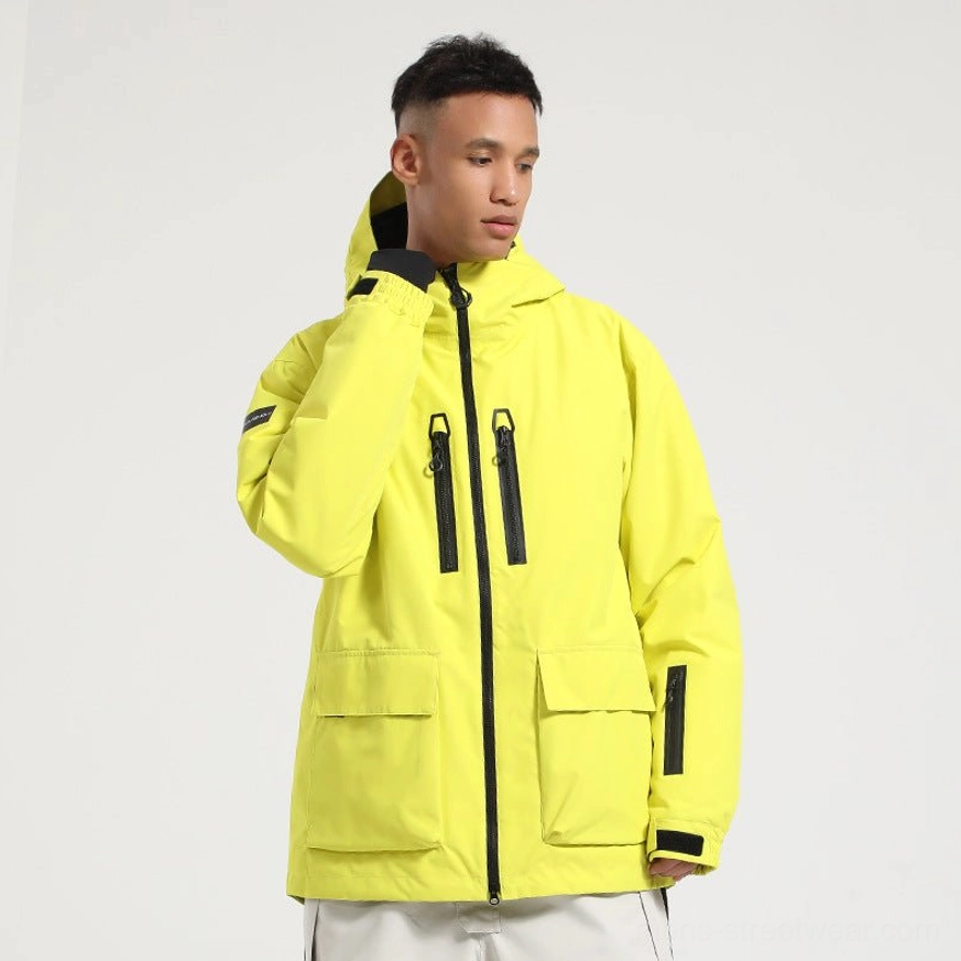 Fluorescent yellow unisex snowboard jacket with black zipper accents functional pockets and hook and loop adjustable cuffs