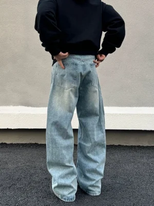Rear view of light blue wide leg baggy denim jeans showing classic back pockets and washed streetwear texture