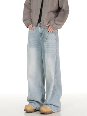 Glacier wash ultra wide leg jeans styled with a grey cropped jacket and tan work boots in a Korean streetwear outfit